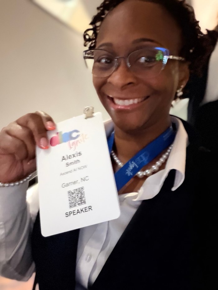 Dr. Smith holding her DLAC Ignite 2026 speaker badge