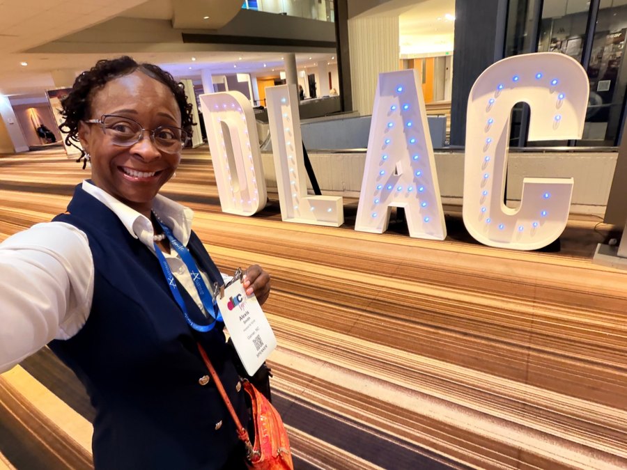 Dr. Smith with the DLAC letters in Atlanta